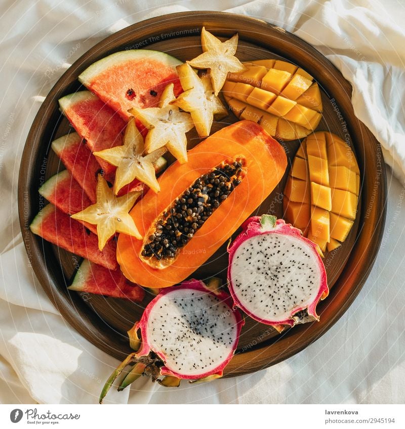 various exotic tropical fruits on a metal tray on bed Bedroom Breakfast Carambole Cut Delicious Dessert Diet Dragonfruit Exotic flat flatlay Food Healthy Eating