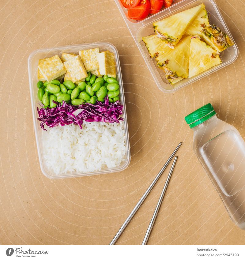 Healthy asian-style vegan bento box Square Green Bottle Water flat lay cherry tomatoes Cut Pineapple Red cabbage Tasty Cooking metal chopsticks takeaway