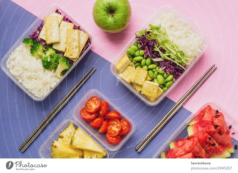 Two healthy asian-style plant-based lunch boxes knolling Apple flatlay Asian Food Asian rice dish bento Broccoli Tomato Container Delicious Diet Dinner Dish