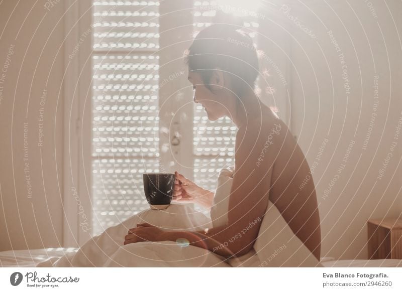woman on bed enjoying a cup of coffee. morning Beverage Coffee Lifestyle Happy Beautiful Body Relaxation Leisure and hobbies Sun Flat (apartment)