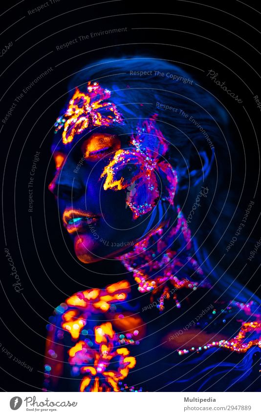 Beautiful flowers in UV light on a young girl face and body Style Body Face Make-up Woman Adults Art Elements Earth Water Flower Love Fantastic Uniqueness Blue