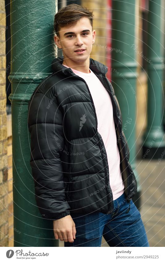 Young man standing in urban background with modern hairstyle. Lifestyle Style Human being Masculine Youth (Young adults) Man Adults 1 18 - 30 years Street