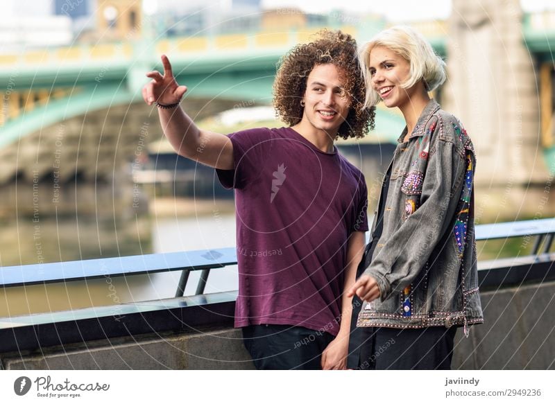 Happy couple talking sitting near River Thames Joy Hair and hairstyles Vacation & Travel To talk Human being Masculine Feminine Young woman Youth (Young adults)