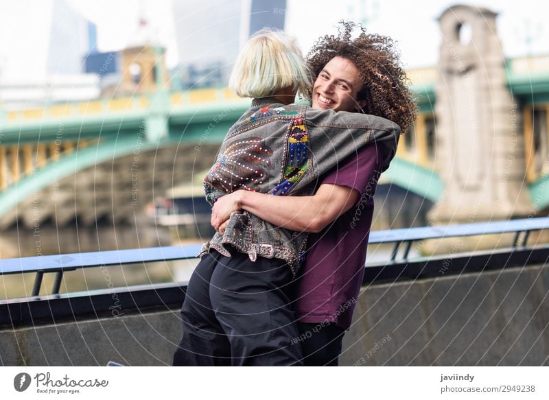 Happy couple hugging near the Southwark bridge Joy Human being Masculine Feminine Young woman Youth (Young adults) Young man Woman Adults Man Friendship Couple