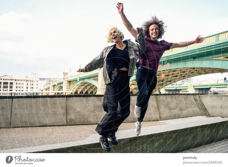 Funny couple junping near the Southwark bridge over River Thames Joy Happy Beautiful Vacation & Travel Human being Masculine Feminine Young woman