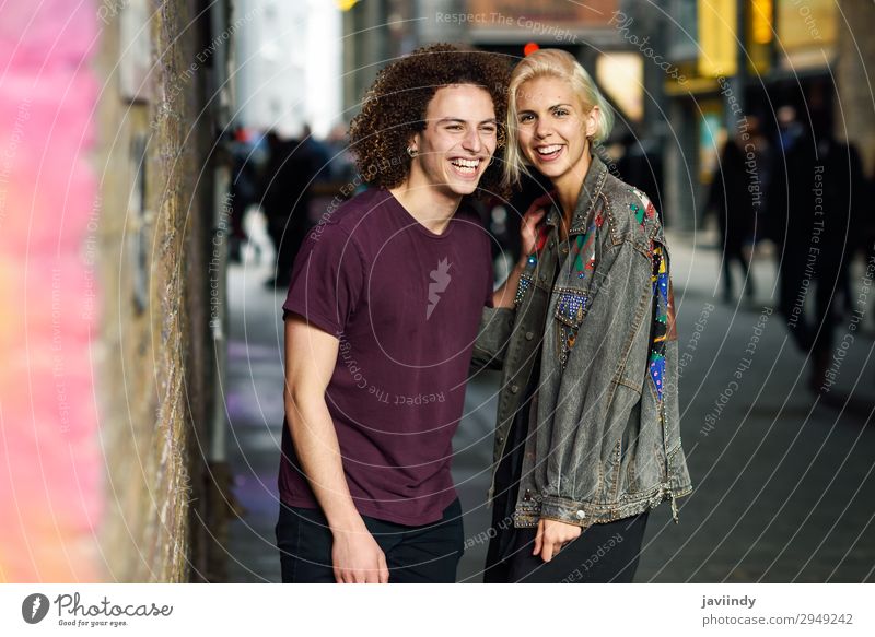 Happy couple talking in urban background on a typical London Lifestyle Joy Beautiful Hair and hairstyles To talk Human being Masculine Feminine Young woman