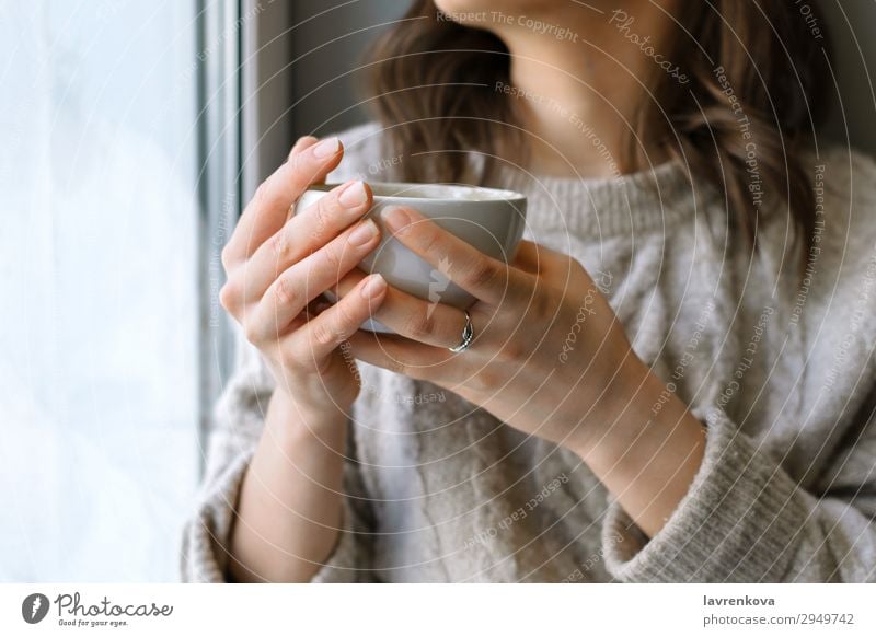 woman's holding cup with latte in front of the window Café Close-up Coffee Cup Beverage Drinking Woman Shallow depth of field Young woman Home Hot hygge