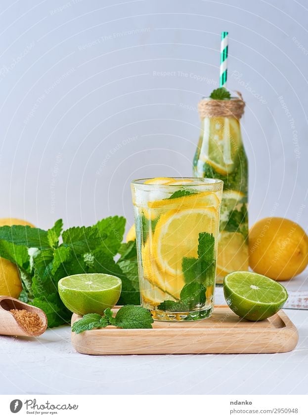 summer refreshing drink lemonade with lemons Fruit Herbs and spices Beverage Cold drink Lemonade Juice Alcoholic drinks Bottle Glass Summer Table Leaf