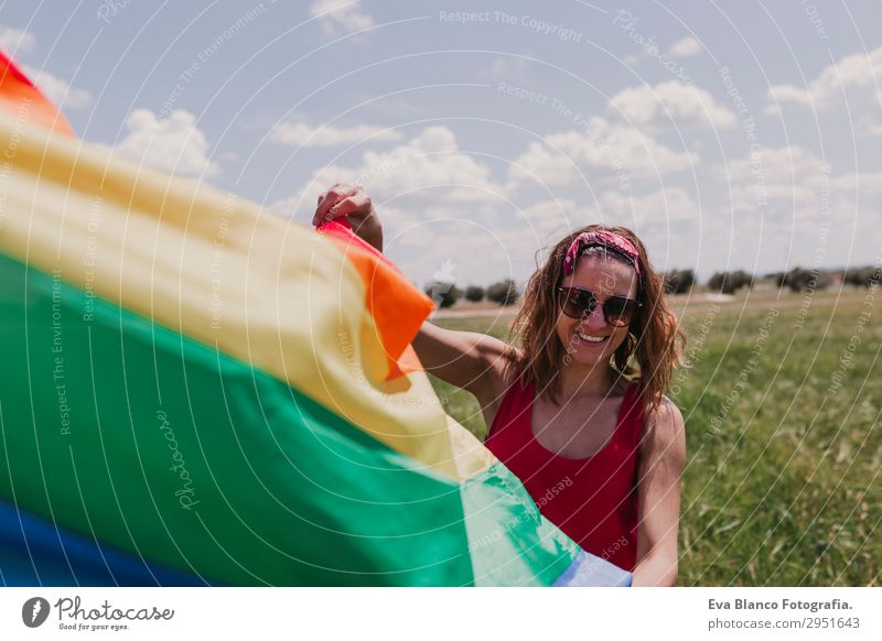 Woman holding the Gay Rainbow Flag on green meadow outdoor Lifestyle Joy Happy Leisure and hobbies Freedom Summer Sun Wedding Human being Feminine Homosexual