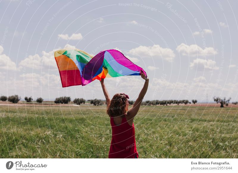 Woman holding the Gay Rainbow Flag on green meadow outdoors Lifestyle Joy Happy Leisure and hobbies Freedom Summer Sun Wedding Human being Feminine Homosexual