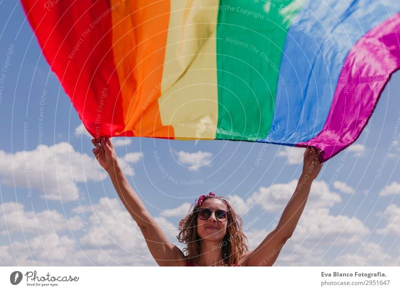 Woman holding the Gay Rainbow Flag over blue sky outdoors Lifestyle Joy Happy Leisure and hobbies Freedom Summer Sun Wedding Human being Homosexual Young woman