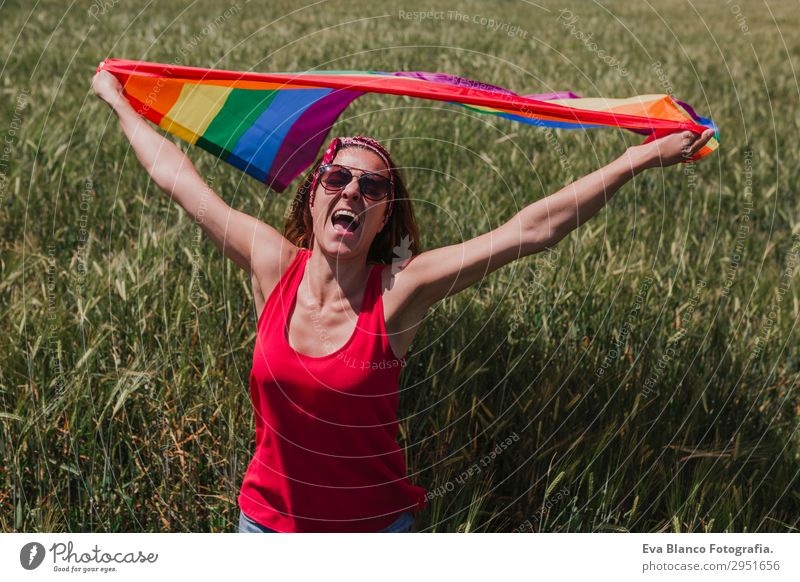 Woman holding the Gay Rainbow Flag on a green meadow outdoors Lifestyle Joy Happy Leisure and hobbies Freedom Summer Sun Wedding Human being Feminine Homosexual
