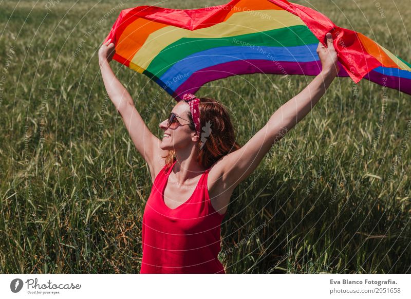 Woman holding the Gay Rainbow Flag on green meadow outdoor Lifestyle Joy Happy Freedom Summer Sun Wedding Human being Feminine Homosexual Young woman
