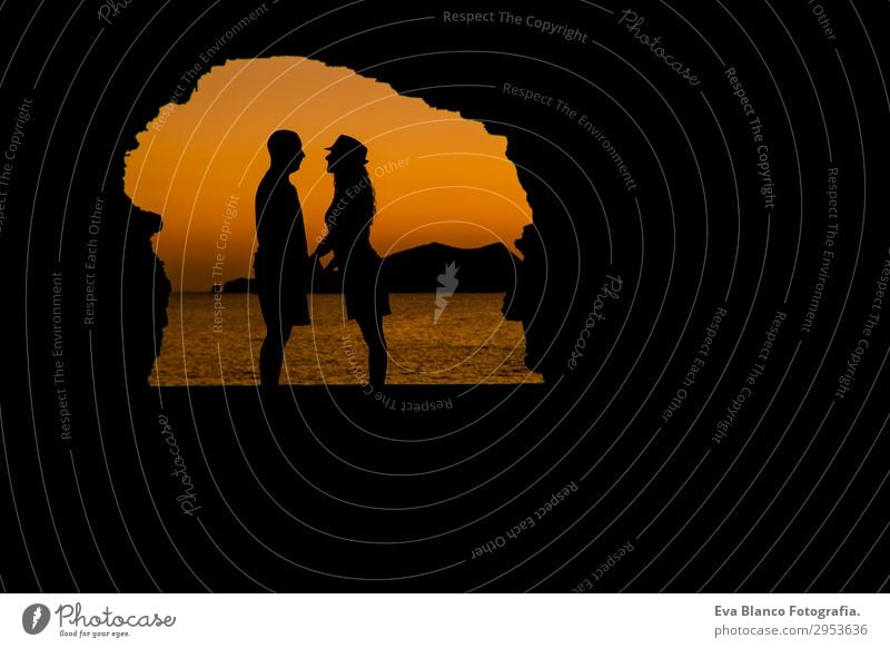silhouette of young couple loving at the beach at sunset Playing Vacation & Travel Sun Beach Ocean Island Flirt Young woman Youth (Young adults) Young man Woman