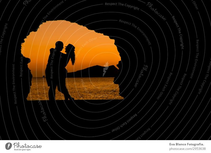 silhouette of young couple loving at the beach at sunset Leisure and hobbies Playing Vacation & Travel Sun Beach Ocean Island Flirt Masculine Feminine