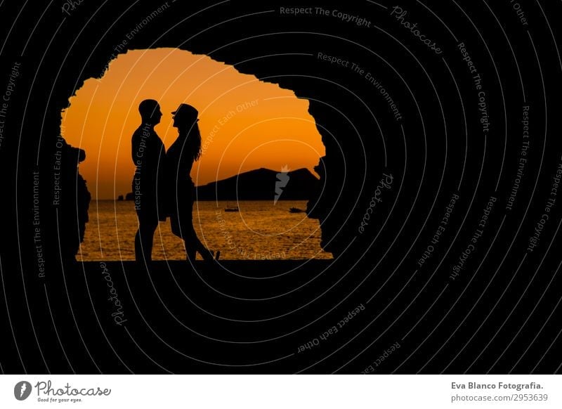 silhouette of young couple loving at the beach at sunset Lifestyle Leisure and hobbies Playing Vacation & Travel Sun Beach Ocean Island Flirt Masculine Feminine