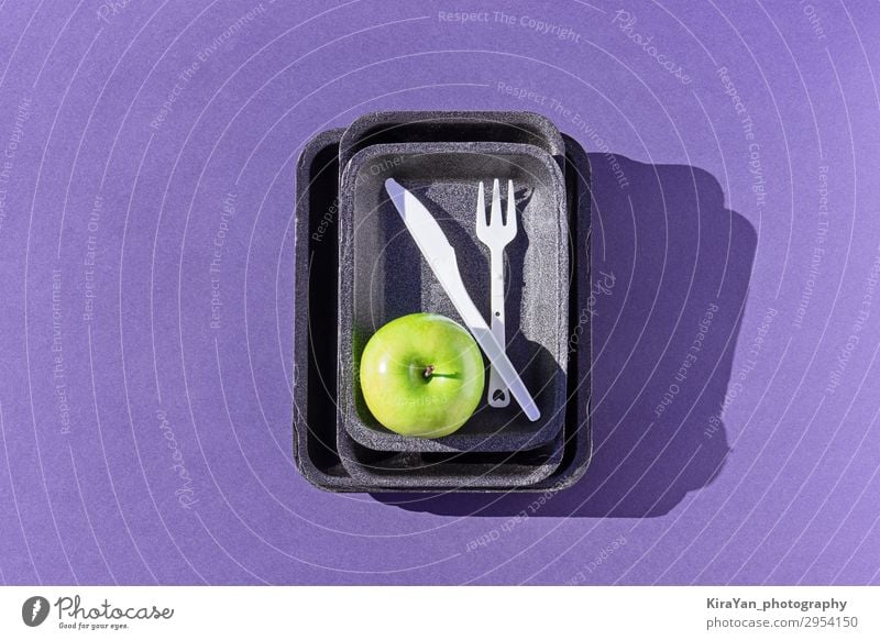 Top view of an empty plastic tray with green apple on purple Apple Diet Fork Lifestyle Shopping Environment Climate change Container Pack Packaging Package Box