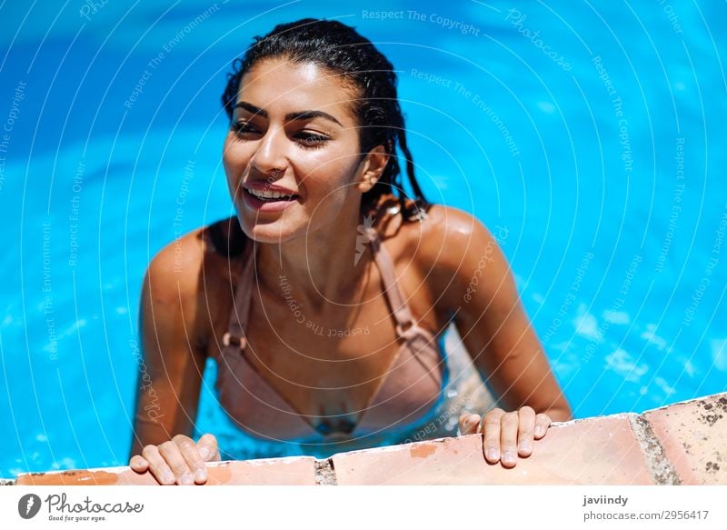 Young woman with beautiful body in a beach hut - a Royalty Free Stock Photo  from Photocase