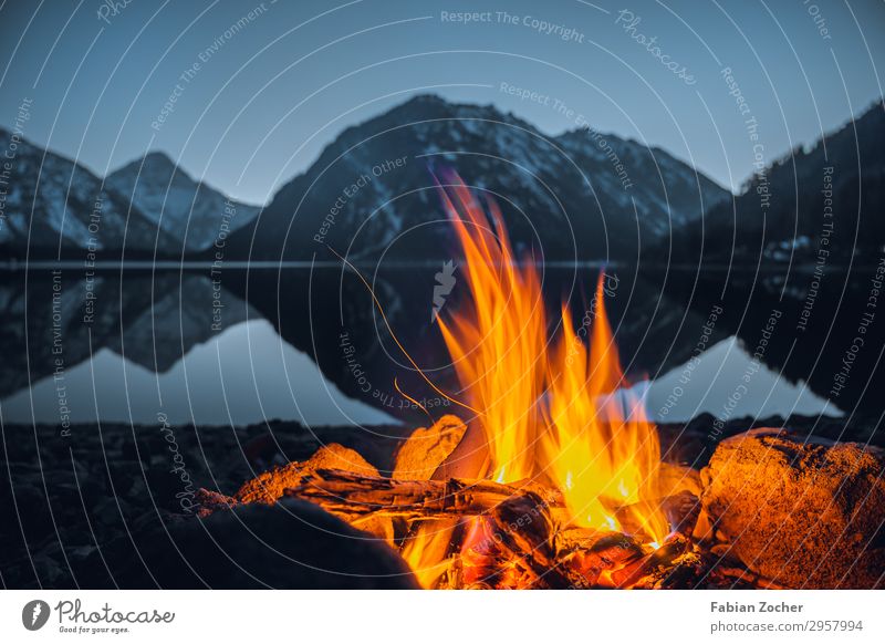 Fire at Plansee Trip Adventure Camping Mountain Nature Landscape Water Cloudless sky Sunrise Sunset Alps Snowcapped peak Lakeside Illuminate Fantastic Natural