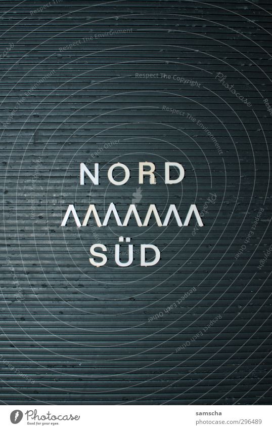 North - South Sign Characters Digits and numbers Ornament Signs and labeling Vacation & Travel Write Thorny Black Aggression War Mobility Politics and state