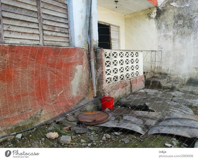 Cuban entrance Deserted Wall (barrier) Wall (building) Facade Terrace Window Door Bucket Old Poverty Authentic Dirty Simple Broken Derelict Colour photo