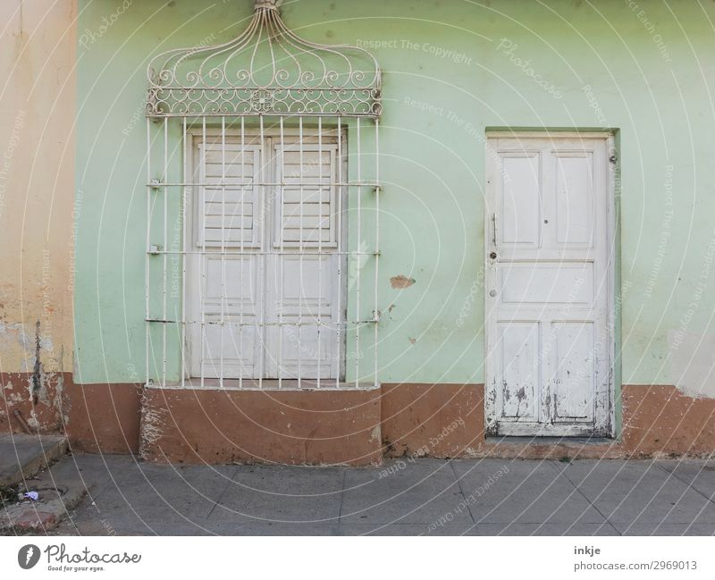 Cuban shop closing time Village Small Town Deserted House (Residential Structure) Facade Window Door Grating Ornament Old Authentic Simple Brown White