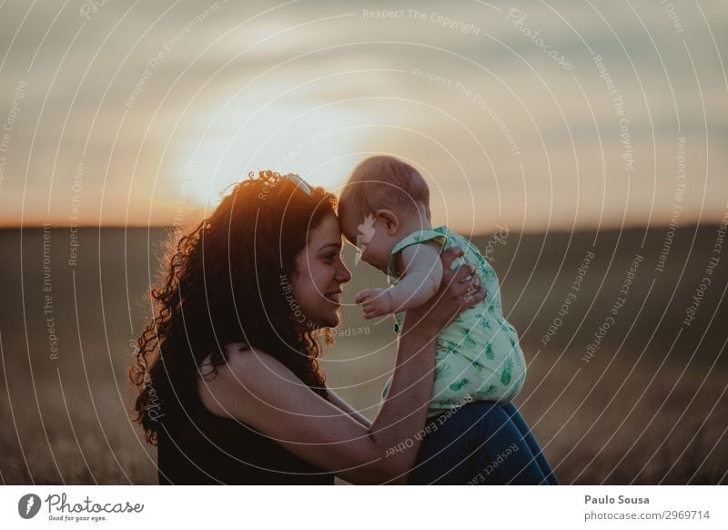 Mother and Daughter at sunset motherhood Family & Relations Together togetherness Sunset Child Happy Lifestyle Happiness Love people Parents Joy Adults Smiling