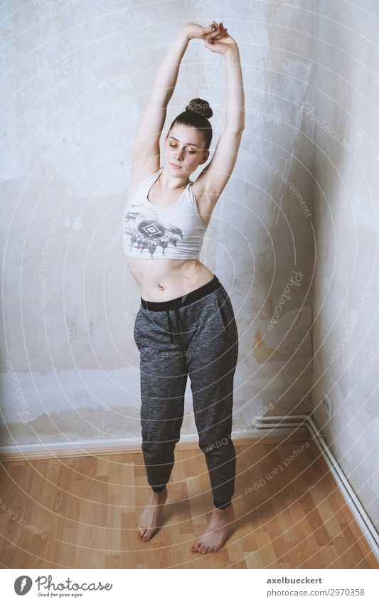 stretching Lifestyle Healthy Athletic Fitness Leisure and hobbies Flat (apartment) Room Sports Sports Training Sportsperson Human being Feminine Young woman