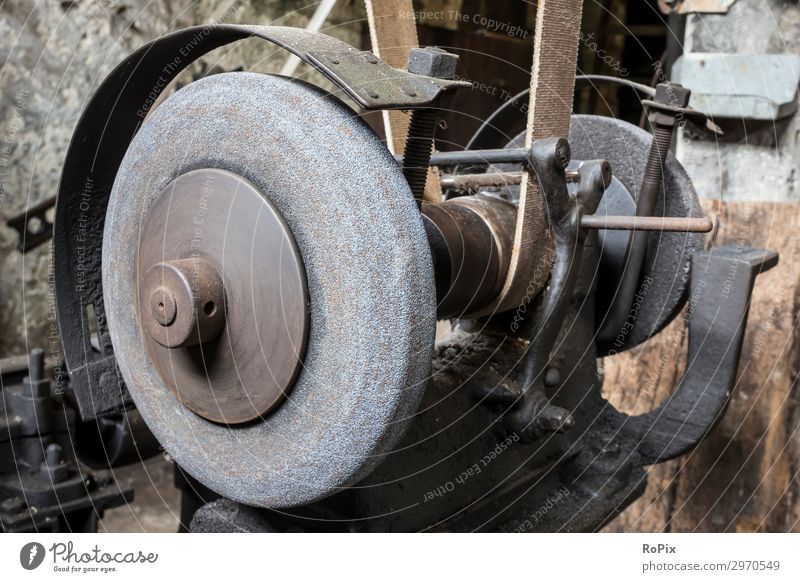 Historic grindstone in the toolshop of a blacksmith. Work and employment Profession Workplace Construction site Factory Economy Industry Trade Company Tool