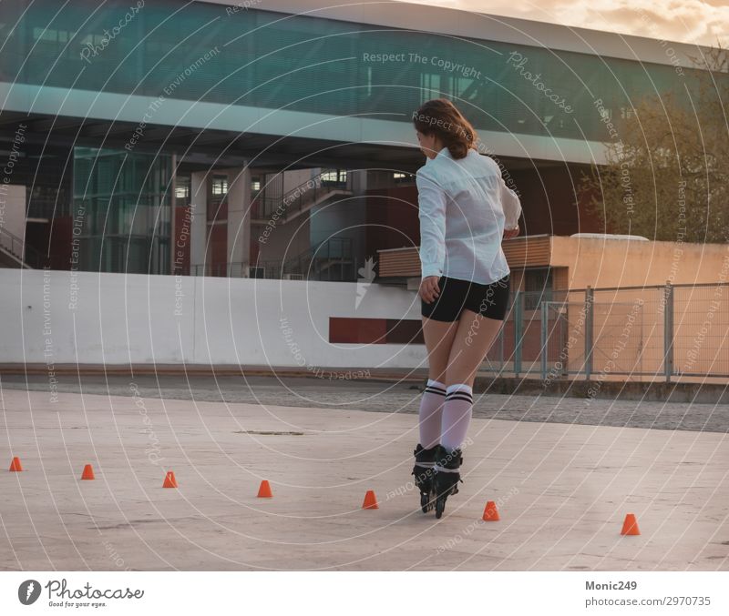 Beautiful young woman having fun with roller skates Lifestyle Style Joy Happy Leisure and hobbies Freedom Sports Human being Feminine Young woman
