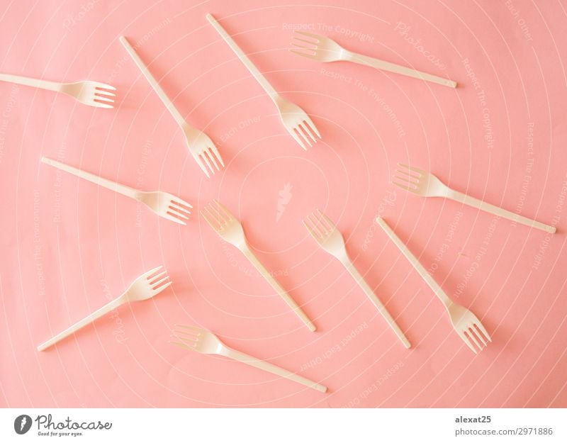 Plastic fork pattern on pink background Cutlery Fork Design Table Kitchen Bright Pink White Colour colorful copy eat equipment forks Horizontal isolated