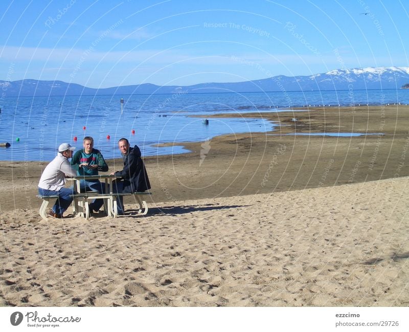 There was a bank on the beach. Beach Lake California Nevada Bench Sit Water lake tahoe USA Lakeside Sand Sandy beach Vacation photo Far-off places Tourist