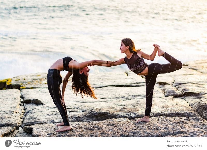 Two girls on the beach doing yoga at sunset. Lima Peru. Lifestyle Happy Beautiful Body Wellness Relaxation Summer Sun Beach Ocean Sports Yoga Human being Woman