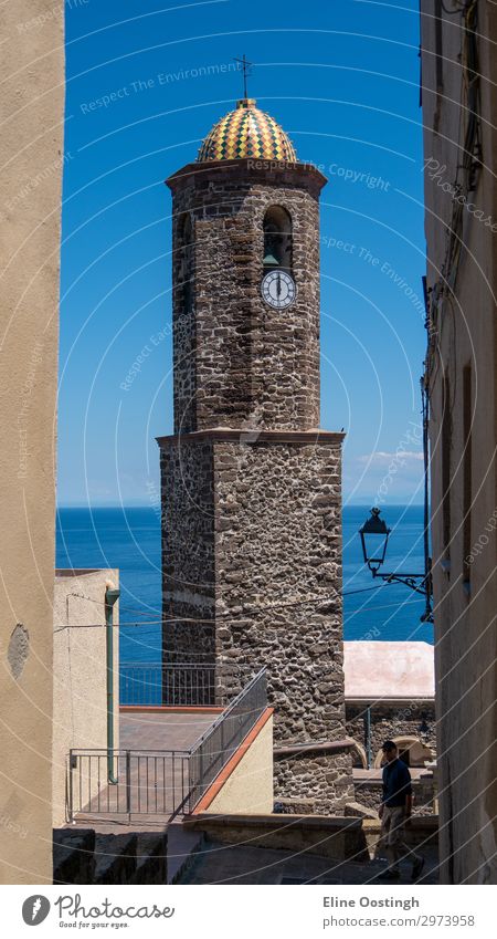 high tower made of stones with clock in the middle architecture believe brick brick building brick church facade city clock tower faith sea seetrough