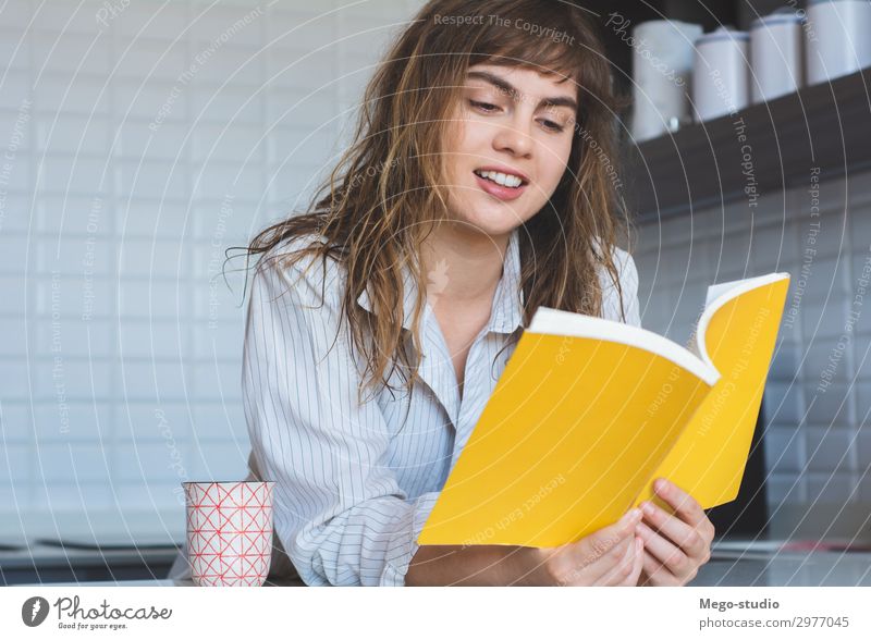 woman reading a book Breakfast Lifestyle Joy Happy Beautiful Relaxation Reading House (Residential Structure) Table Kitchen Human being Woman Adults Book Think