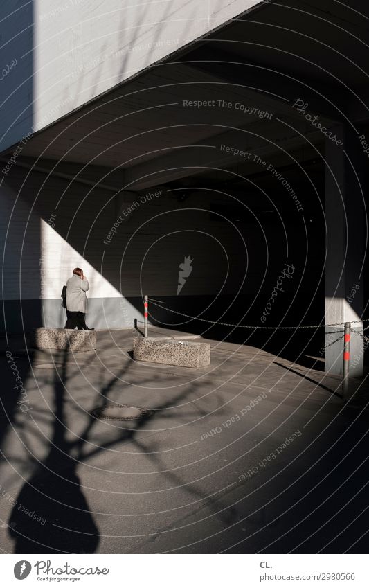 telephoning woman photographed by man Human being Feminine Woman Adults Life 1 Beautiful weather Building Wall (barrier) Wall (building) Traffic infrastructure