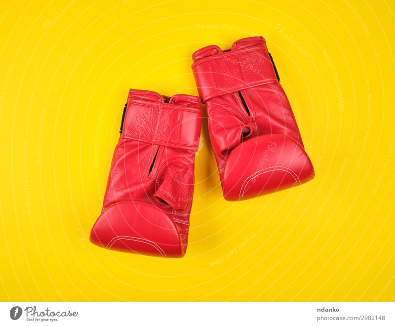 pair of red leather boxing gloves Lifestyle Sports Track and Field Leather Gloves Fitness Yellow Red Protection Competition Power Style Action background boxer