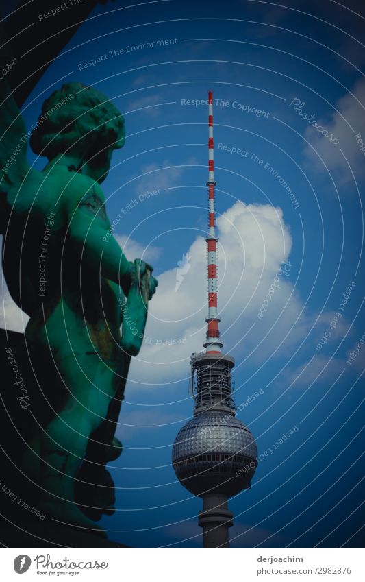 The Berlin television tower is under observation from a statue. The tower with white clouds Style Joy Trip City trip Work of art Sculpture Architecture Summer