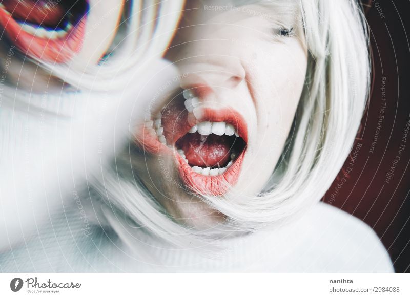 Artistic and conceptual image about personality disorder Medical treatment Medication Mirror Woman Adults Blonde Scream Sadness Crazy Emotions Stress Distress