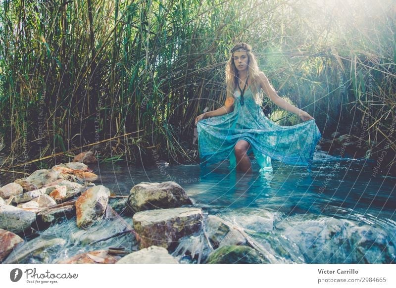 A Blonde pretty young boho style woman in a river in summer Lifestyle Elegant Style Design Exotic Feminine Young woman Youth (Young adults) Woman Adults 1