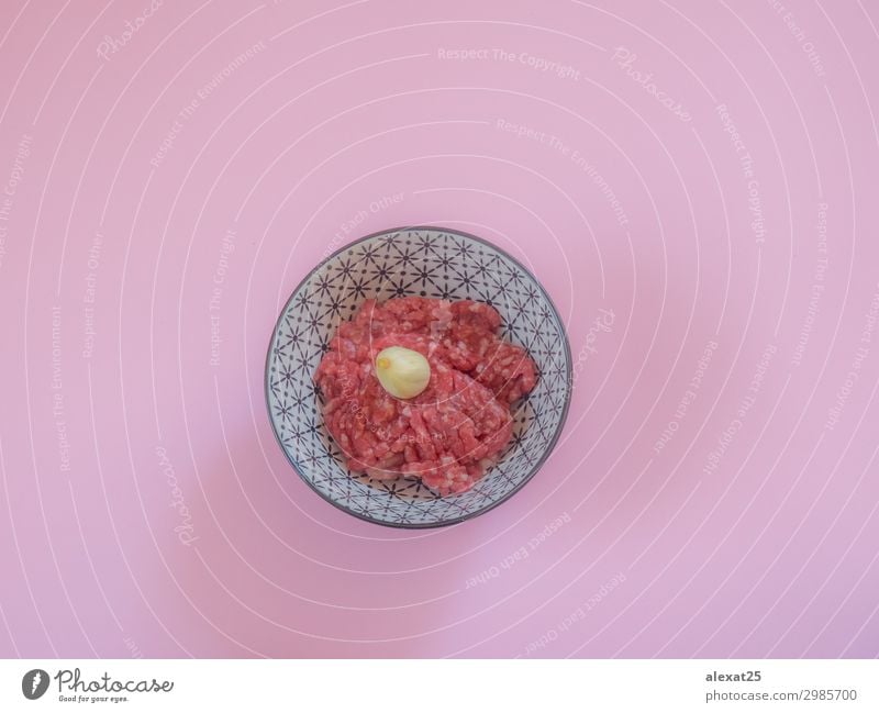 Minced beef meat in a bowl on pink background Meat Nutrition Fresh Pink Red Beef burger butcher Cooking fat flat lay food Ground Hamburger healthy Heap