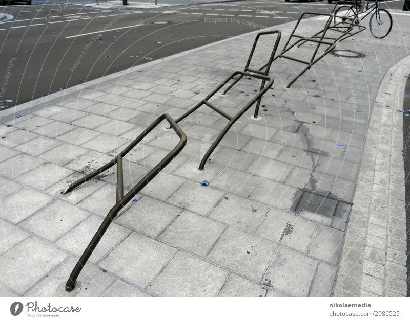 Bicycle stand after the witches' night Saarbrücken Germany Europe Town Capital city Cycling Street Stupid Aggression Black & white photo Subdued colour