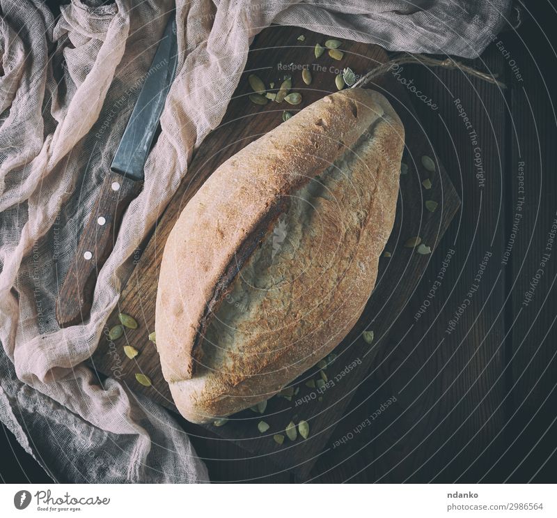 baked crisp oval bread and vintage knife Bread Nutrition Eating Table Kitchen Wood Fresh Natural Above Brown Tradition Baking Bakery board Crust Flour food