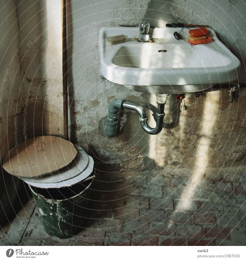 Covered Washhouse Sink Bucket soapbox Tap Brick Cardboard paper cover Stone Metal Plastic Illuminate Old Dirty Trashy Past Transience Ravages of time Drainage