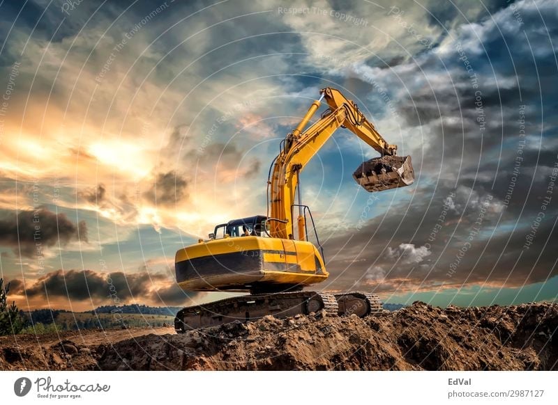 Crawler excavator during earthmoving works on construction site at sunset colorful impressive loader hydraulic scenic amazing tractor industrial industry
