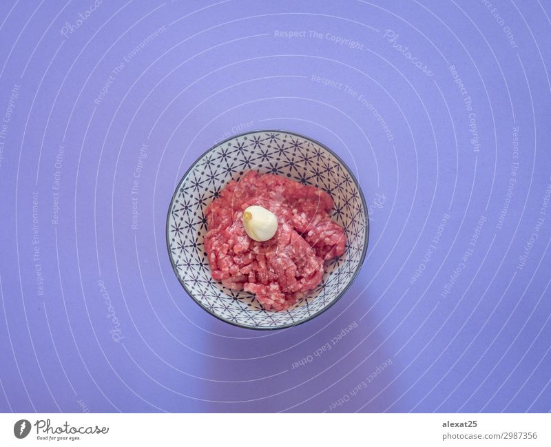 Minced beef meat in a bowl on purple background Meat Nutrition Fresh Red Beef burger butcher Cooking fat flat lay food Ground Hamburger healthy Heap Ingredients