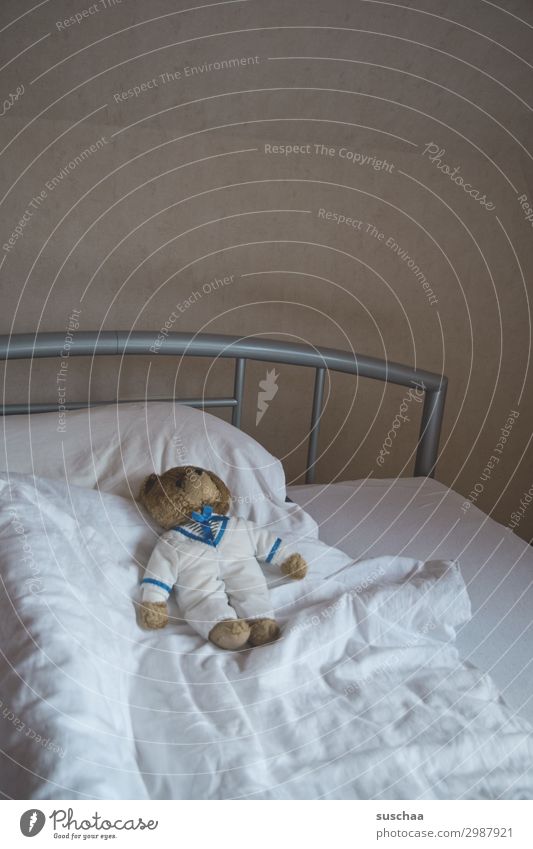 empty bed with an old teddy bear Bed Duvet Pillow Teddy bear Retro iron rod Bedstead Wall (building) Mattress Sheet White minimal Sleep go to bed Dream Cuddling