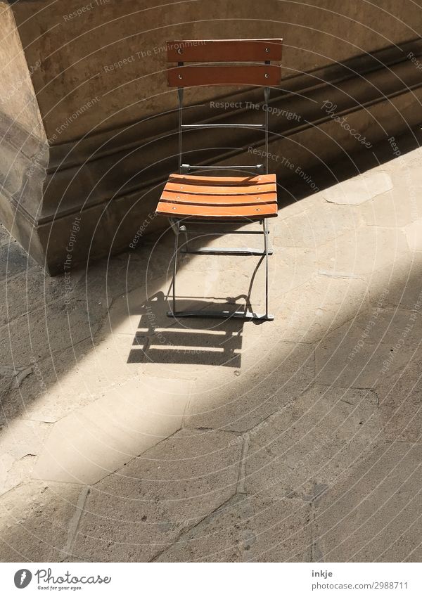 Folding chair in Prague Deserted Terrace Column Corner Chair Wooden chair Simple Sun Individual Colour photo Exterior shot Close-up Copy Space bottom Day Light