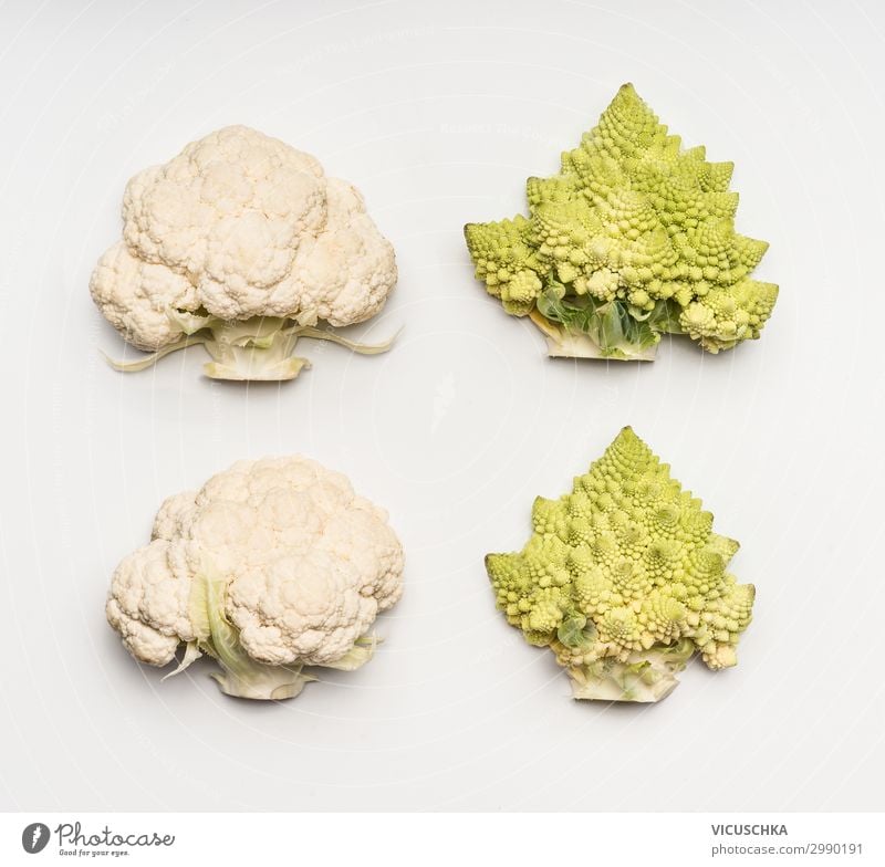 Cauliflower and Romanesco cabbage on white background Food Vegetable Nutrition Lifestyle Style Design Healthy Eating Vitamin Broccoli Half Bright background