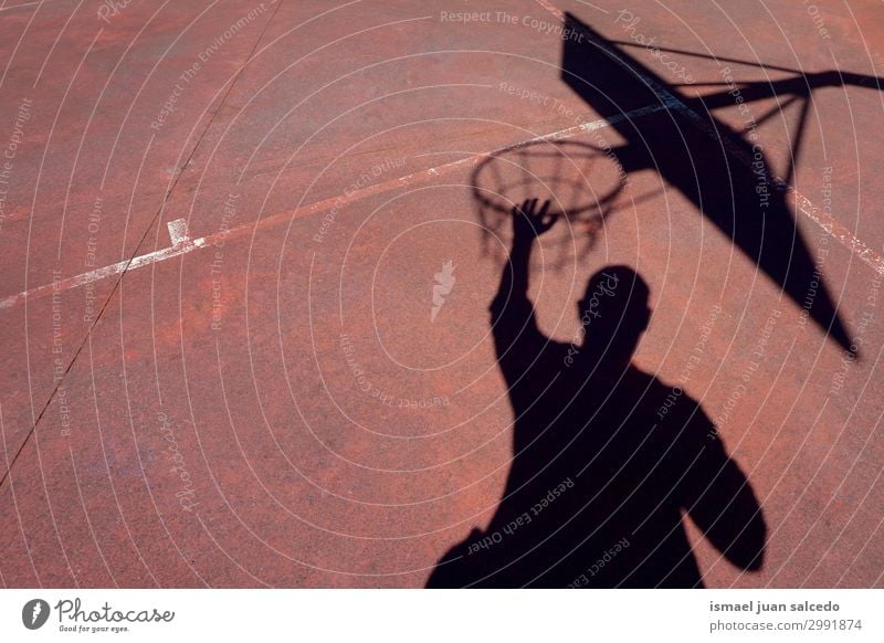 man playing basketball shadow silhouette in the street Basketball Shadow Silhouette Sunlight Ground Playing field Story Sports Abandon Street Park Playground